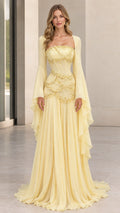 Front view of pastel yellow square neck beaded corset evening gown with dramatic bell sleeves