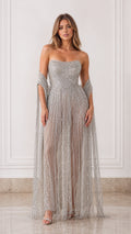 Front view of model wearing silver strapless beaded fringe evening gown with matching shawl