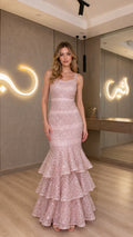 Full front view of blush pink sequin tiered mermaid evening gown
