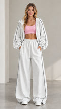Front view of model wearing Heather Grey zip hoodie and wide-leg sweatpants set