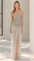 Front view of Champagne strapless beaded fringe evening gown with slit