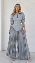 Front view of model wearing heather grey zip corset top and matching pleated wide-leg pants set
