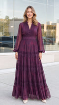 Front full-length view of woman wearing plum lace trim tiered maxi dress