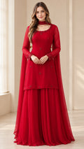 Front full-length view of woman in red embellished sharara suit set