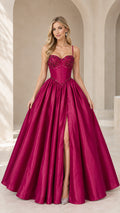 Front view of model wearing magenta beaded corset ball gown with high leg slit