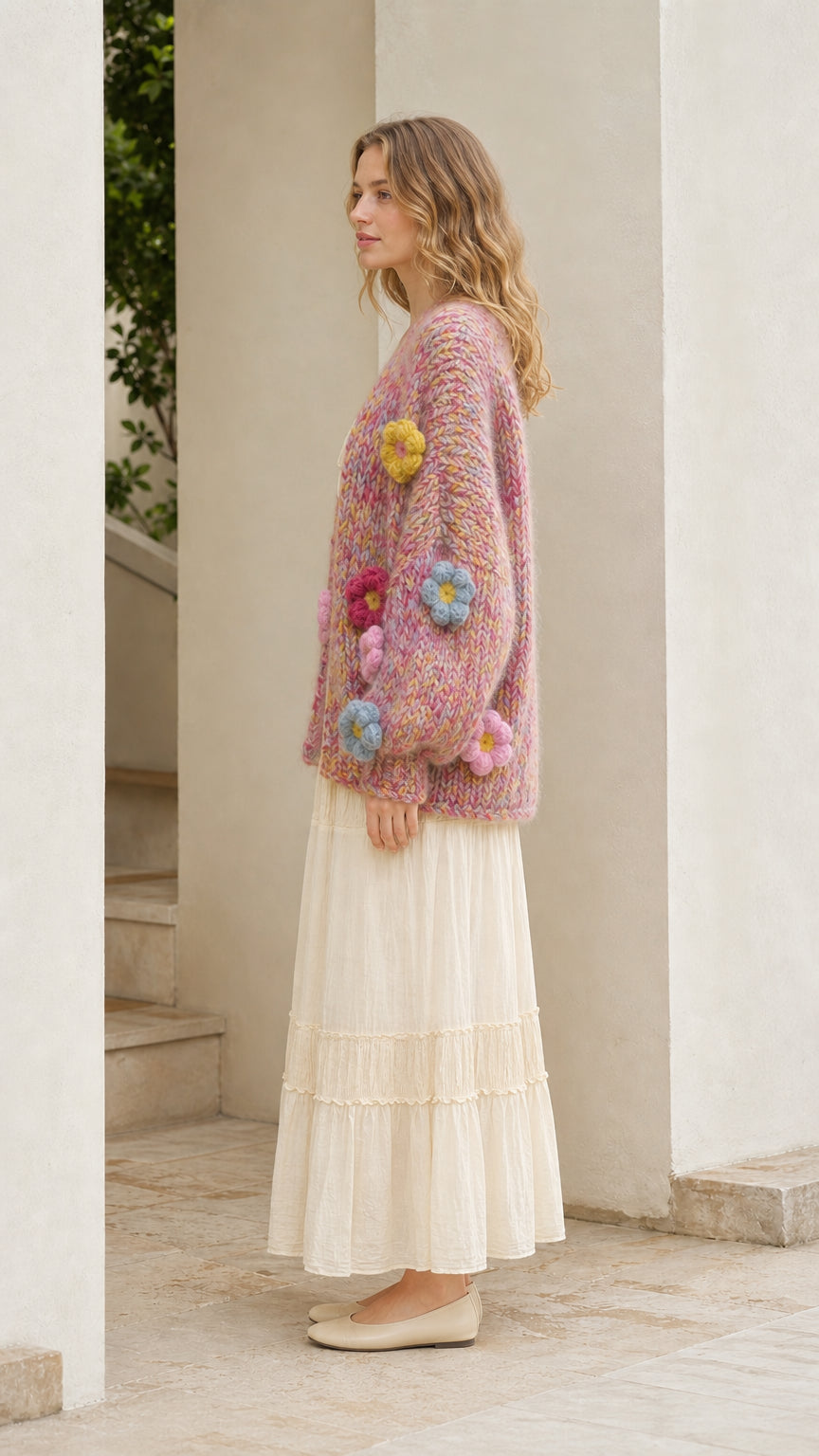 Model wearing pink floral cardigan from the side profile