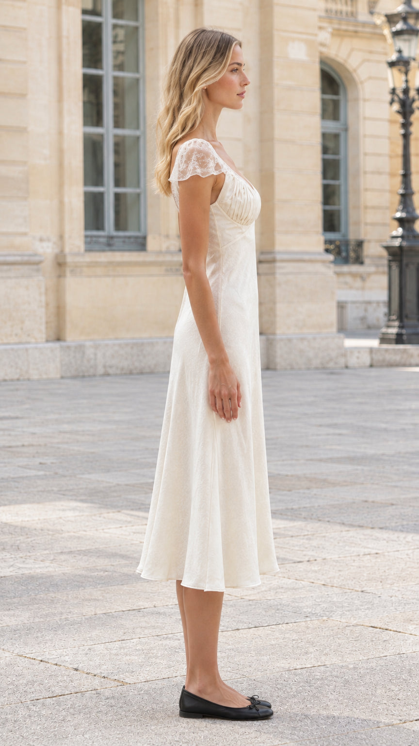 Side profile view of ivory lace sleeve satin midi dress