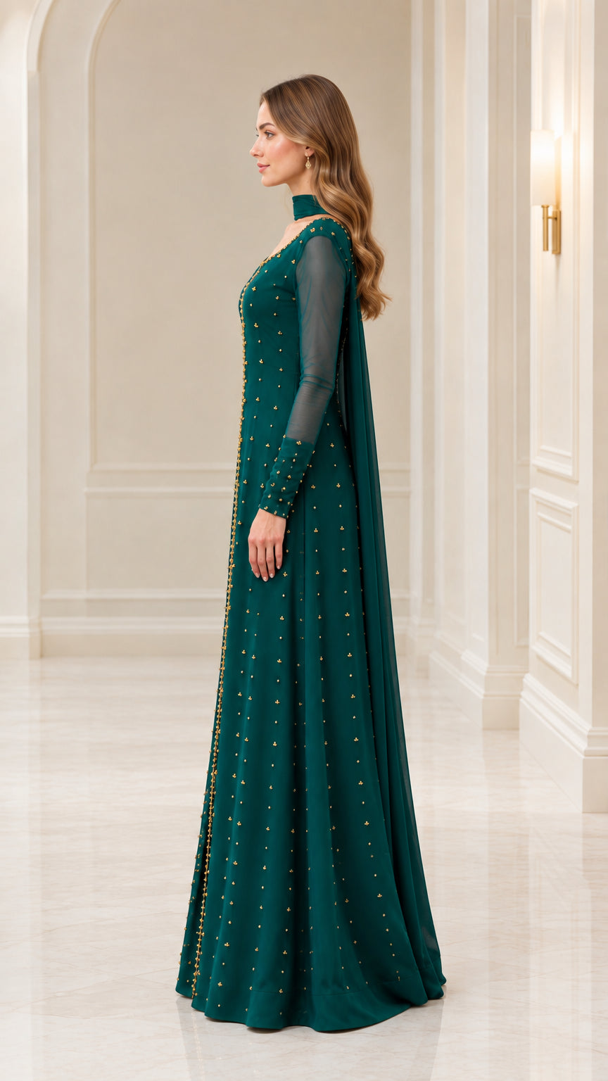 Side profile of emerald green formal maxi dress with sheer sleeves