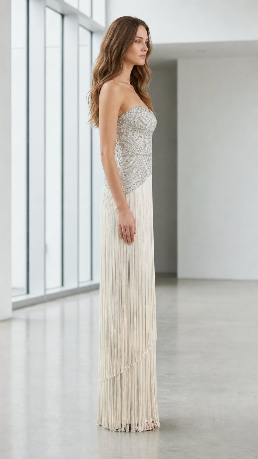 Side profile view of champagne beaded fringe gown