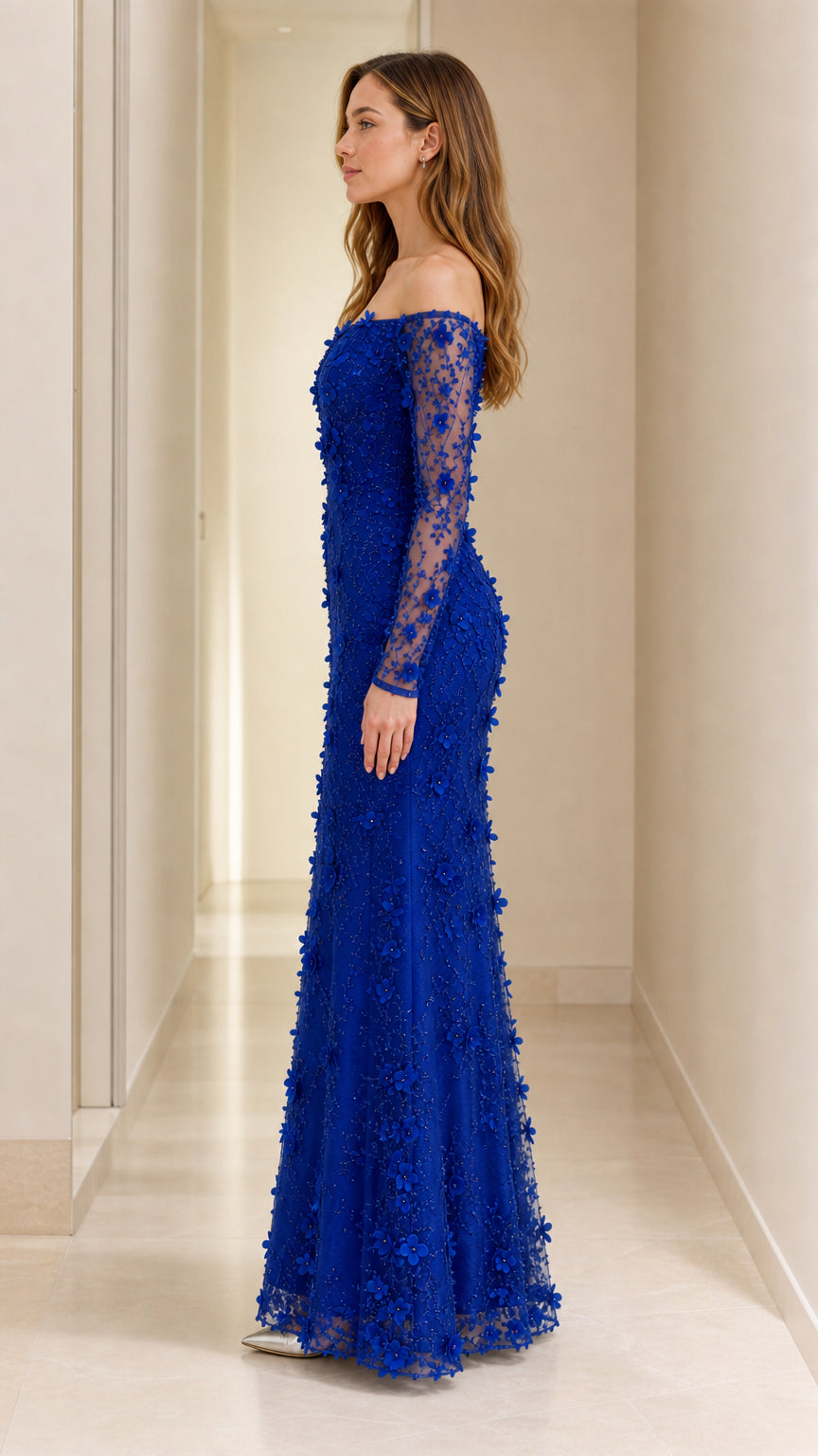 Side profile of royal blue floral applique formal mermaid dress