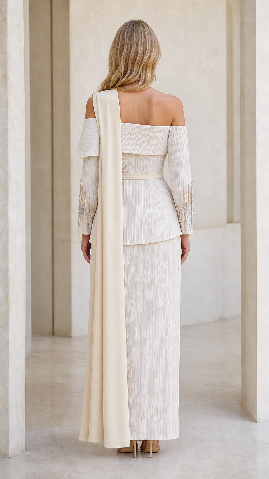 Back view of champagne formal dress with flowing shoulder drape