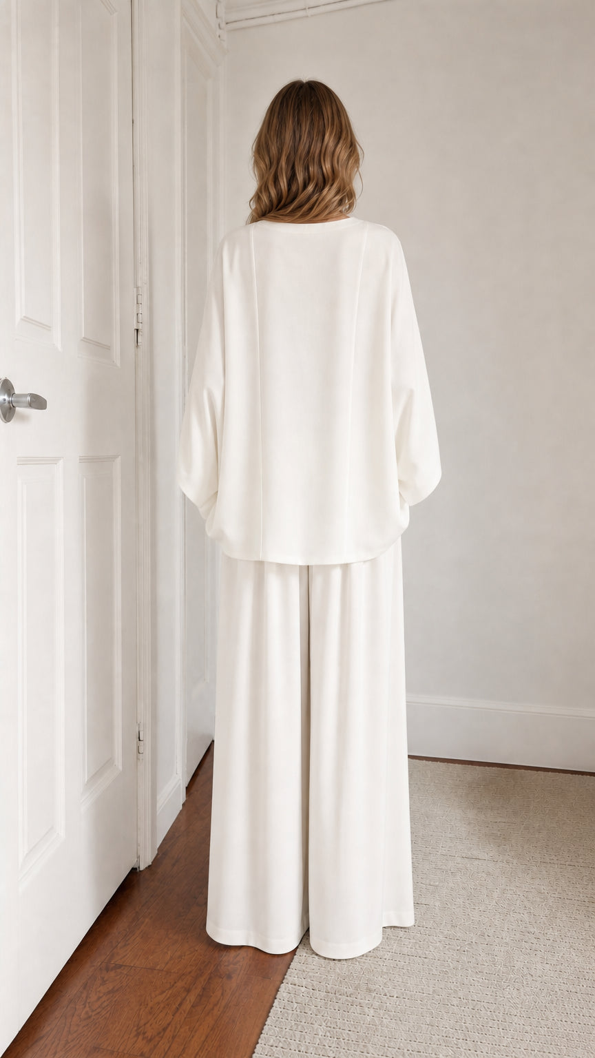 Back view of model in white two-piece lounge set