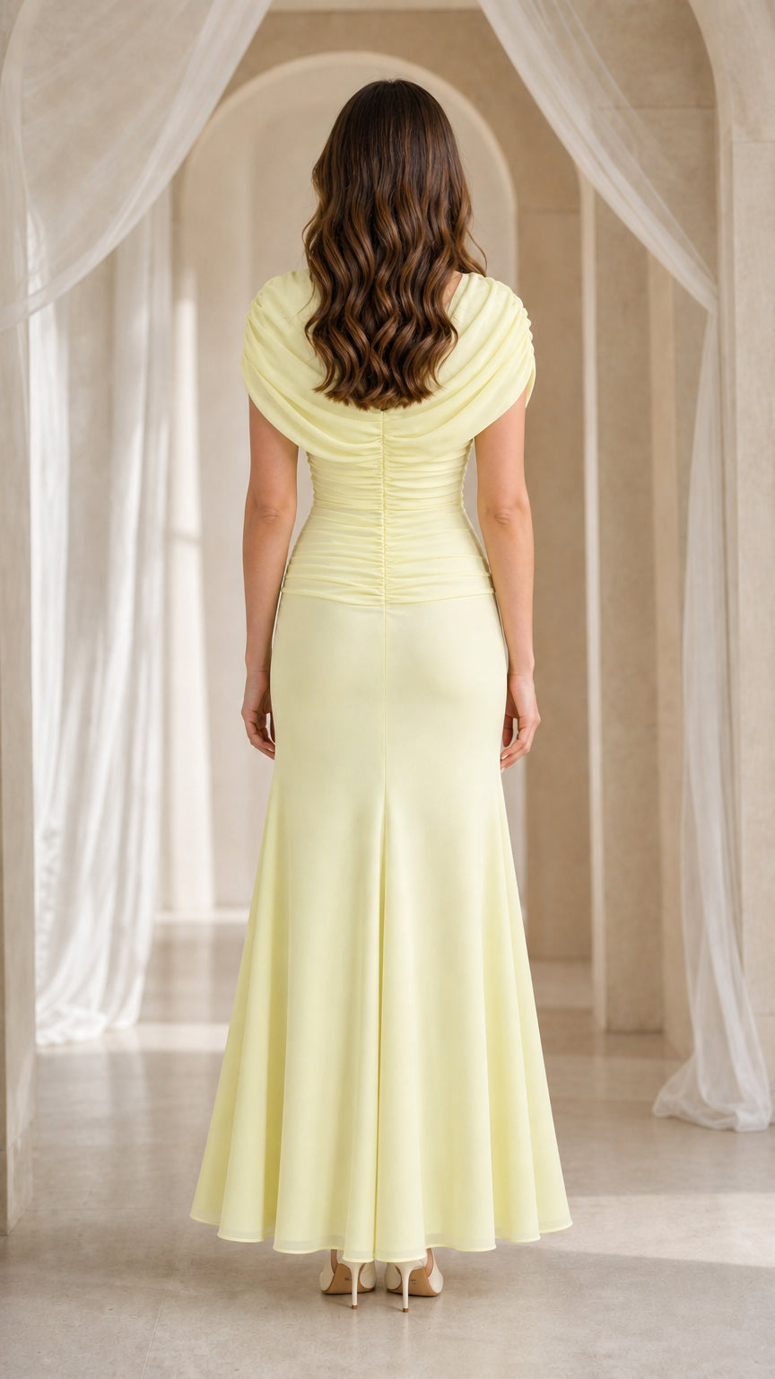 Back view of yellow maxi dress showing train and back draping