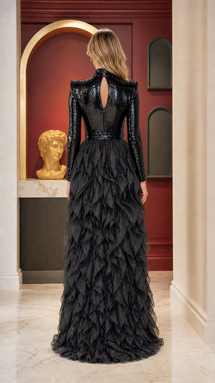 Back view of black sequin evening gown with keyhole back and sweeping ruffle train