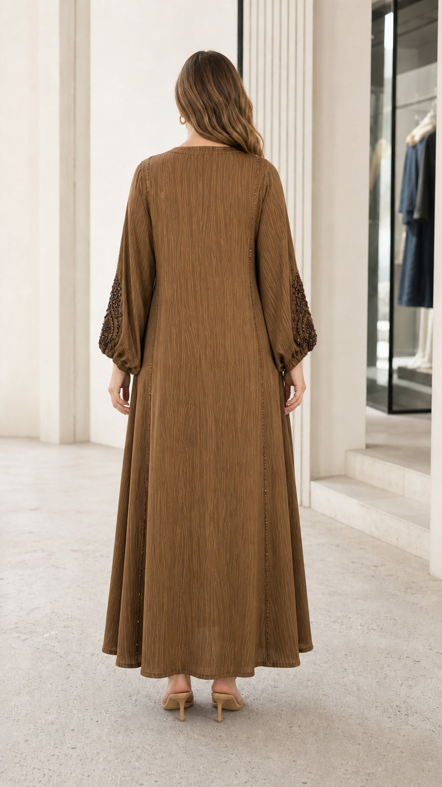 Back view of woman wearing brown full-length modest kaftan dress