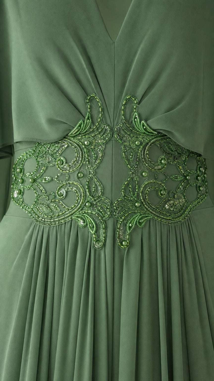 Close-up detail of intricate beaded lace applique on the waist of the dress