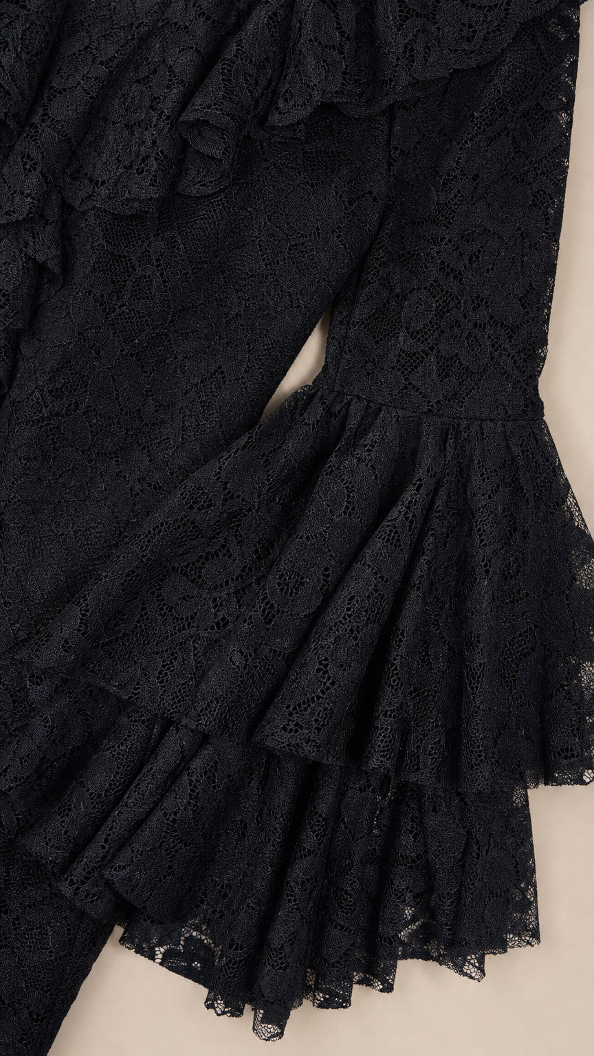 Close-up detail of tiered ruffled lace flounce sleeve cuff in black