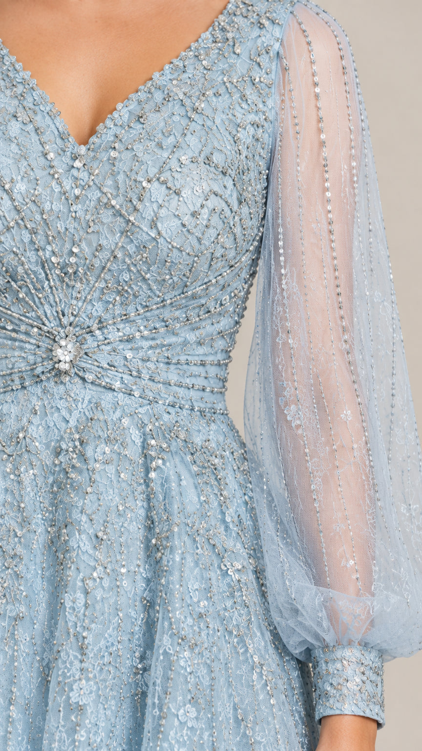Close-up detail of V-neck beaded bodice, crystal waist accent, and sheer sleeve cuff